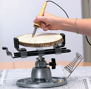 The 350 multi-purpose work center used for crafting an image on a cross-section of a tree trunk