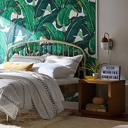 Bed, nightstand, "good morning sunshine" sign