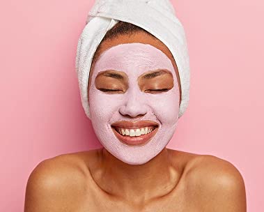 Woman with skin care products