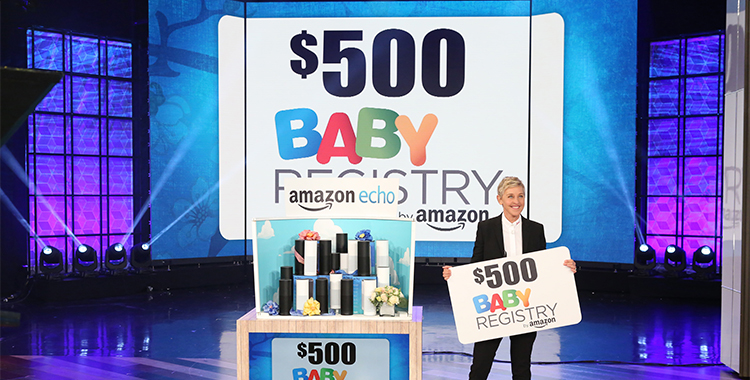 Ellen holding $500 gift card from Baby Registry by Amazon