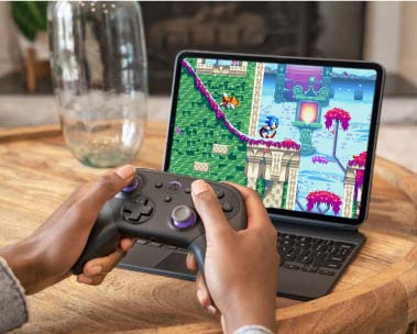 Playing games on laptop.