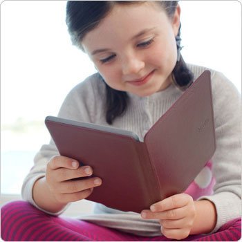 Kindle e-reader: girl reading Kindle with pink Kindle cover.