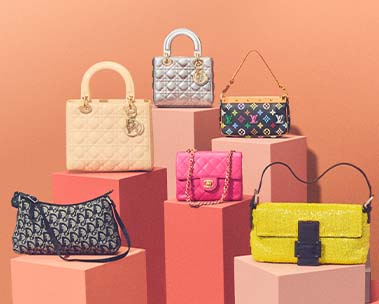 Assorted pre-owned designer handbags displayed side-by-side