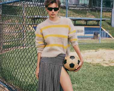 girl in striped sweater and skirt