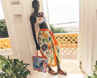 women in colorful swim top and skirt