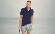 man in polo and shorts