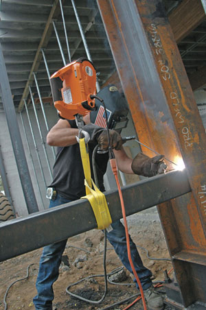 Warn Works 685000 PullzAll 110V AC Corded Electric Pull Tool being used to support a jurder during welding