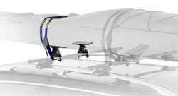 Thule 875XT Hydro-Glide XT Rooftop Kayak Carrier (along with two Set-to-Go saddles at the front) mounted on a roof rack and holding a kayak