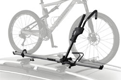 The Thule Sidearm Rooftop Upright Bike Carrier mounted on a car roof rack
