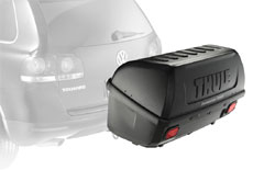 A Thule 665C Transporter Combi Hitch-Mount Cargo Box mounted on a car