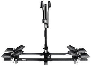 Side view of an isolated Thule 990XT Doubletrack Platform Hitch Bike Rack, erect and without bikes installed