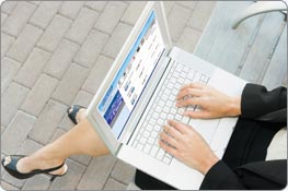 Woman using Schlage LiNK on her laptop