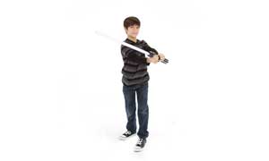 A booy holding STAR WARS ANAKIN SKYWALKER ULTIMATE FX LIGHTSABER
