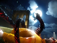 The demon arms of Jackie Estacado devastating an enemy in The Darkness II