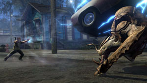 Cole using his abilities to toss a car at a huge enemy in inFAMOUS 2