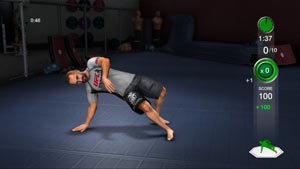 Trainer demonstrating a ground based strength building exercise in UFC Personal Trainer: The Ultimate Fitness System