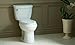 Cimarron Comfort Height® two-piece elongated 1.28 gpf toilet with AquaPiston® flushing technology and left-hand trip lever, seat not included