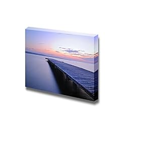 Wooden Pier with Calm Sea at Sunset