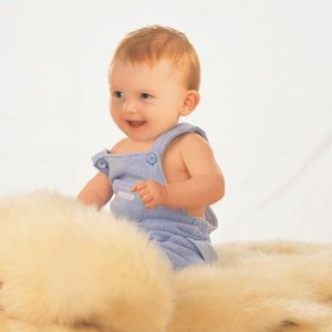 Lambskin babycare rug - unshorn - wool is left natural length. by Bowron
