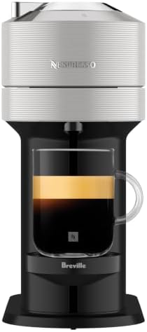Nespresso Vertuo Next Coffee & Espresso Maker by Breville, Light Grey | Light grey coffee machine with slim, sustainable design. Brews 6 cup sizes, espresso to 18 oz., all topped with crema.