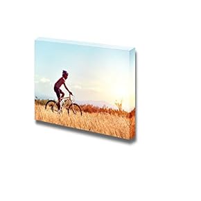 Cyclist Man Riding Mountain Bike in Field Horizontal...