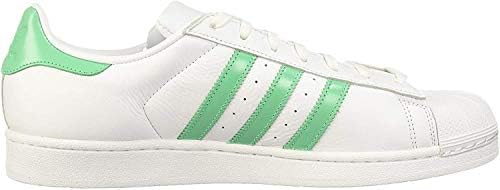 white and green adidas trainers