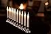 Enchanted Spaces Set of 10 Flameless Ivory Window Candles with Removable Silver Candle Holders, 20 AA Batteries, Window Suction Cups, Remote Control with Daily Timer