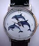 Dolphin watch ladies size - gold tone case with black leather band.