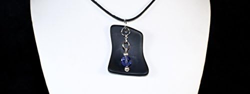 Black Sea Glass Pendant w/ Amethyst Swarovski Crystal Charm. Amethyst is the Birthstone color for February. All Orders Ship with a Waxed Cotton Necklace and Proper Gift Box. Item: AMZN028-BLK