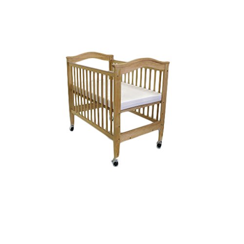 baby crib next to window