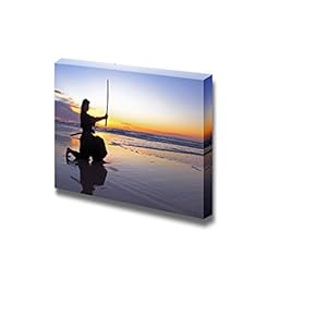 Young Samurai Women with Japanese Sword Katana at Sunset on The Beach - Canvas Art Wall Art - 12" x 18"