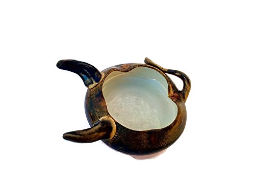 Animal-like hand thrown ashtray red and brown, with tail and horns