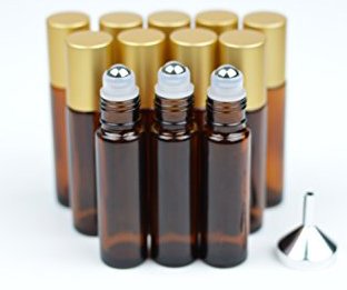 Amber glass roll-on bottle with gold cap. roll on plug …