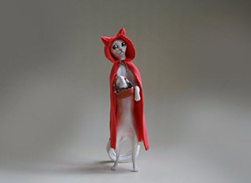 White cat,red coat,cat basket,cat basket,cat fish,red riding hood,fairy tale,sweetheart,sculpture,figurine