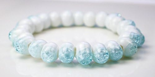 Unusual shaped white glass bead drop shaped with sky blue cracked crystal ending on stretched ribbon lady bracelet