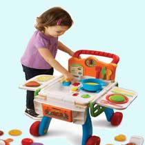 The cart becomes a kitchen, complete with a sink, oven, stove burner, and cutting board.