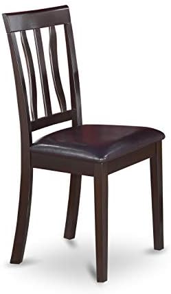 Wooden dining table set with chairs, suitable for a dining room.