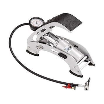 Close Up Of Man Inflating Car Tyre With Foot Pump Stock Photo