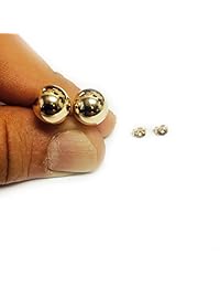 Aretes de oro amarillo de 14 quilates.