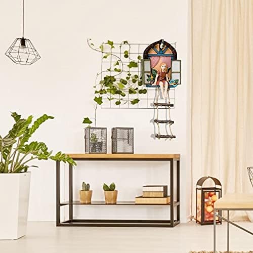 Fairy tree sculpture in a garden setting.