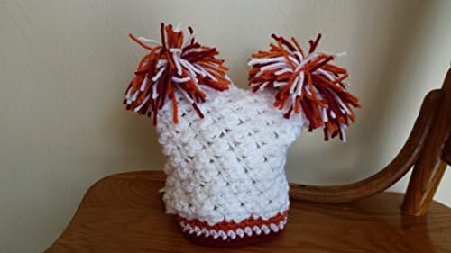 Newborn hand crocheted double pom pom hat in Virginia Tech College team colors of maroon and orange