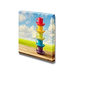 Rainbow Color Cups on Wooden Table Over Beautiful Sky and Meadow - Canvas Art Wall Art - 12" x 12"