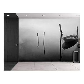 Wall26 - Black and White Photo of a Lone Boat Floating on a Lake - Wall Mural, Removable Sticker, Home Decor - 66x96 inches