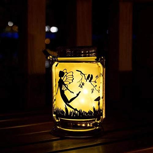 Solar fairy outdoor lantern with a glowing light inside a jar.