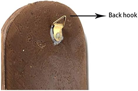 A humorous garden gnome ornament standing next to a tree.