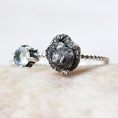 Teardrop Rough diamond ring in silver bezel setting and round faceted blue topaz on the side with sterling silver twist design band