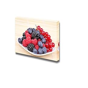 Closeup of Assortment of Sweet Berries on White...