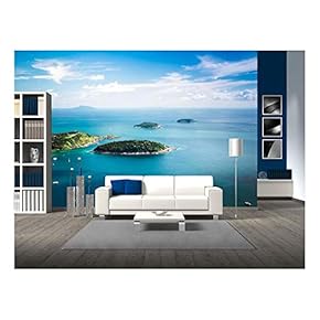 Tropical Ocean Landscape with KOH Kaeo Island at Turquoise Ocean Waives with Boats Near Ya NUI Beach. - Removable Wall Mural | Self-Adhesive Large Wallpaper - 66x96 inches