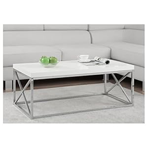 White modern table infront of a couch