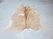 BUTTER CREAM AND WHITE COWHIDE RUG
